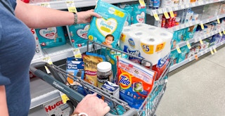 someone shopping at Walgreens, filling a shopping cart with items