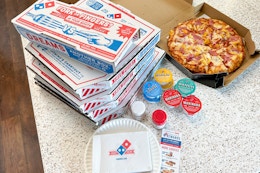 A stack of Domino's Pizza boxes.