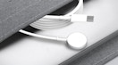 an Apple watch charger in a grey pouch
