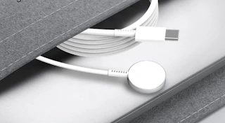 an Apple watch charger in a grey pouch