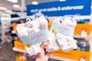 hand holding 2 packs of cat & jack kids socks at target