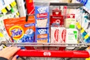 person pushing a cart with tide pods, pop-tarts, old spice body wash, colgate toothpaste, and cerave cleanser in it