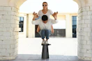 Lifestyle image of the Suproot Telescopic Stool of 2 people balancing on top