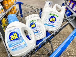 white all free & clear brand detergent pods and liquid containers in the a Walmart cart