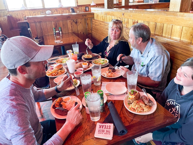 A family eating together at Outback Steakhouse