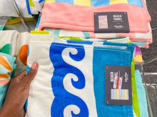 hand holding up Martha Stewart Clearance Bath Towels