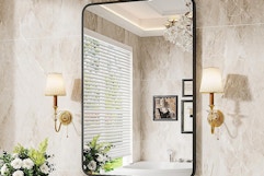 a bathroom mirror in a bathroom