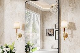 a bathroom mirror in a bathroom