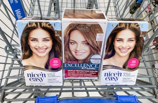 two boxes of clairol nice 'n easy hair color with one box of l'oreal paris excellence hair color in a walmart cart