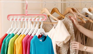 clothes hanging on a pink space saving hanger
