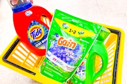 tide and gain products in a yellow shopping basket