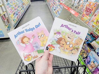 hand holding arthur books