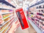 hand holding revlon flat iron in walmart aisle
