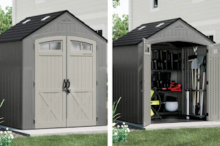 gray storage shed with the doors closed and open