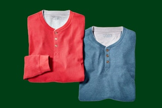 two mens henley shirts on a green background