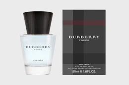 a bottle of cologne next to it's packaging