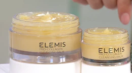 two yellow glass jar cleansing balms