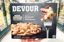 hand holding a devour frozen meal