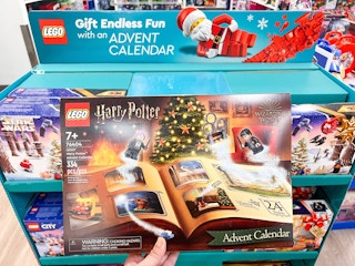 hand holding Lego Advent Christmas Holiday Set from Kohl's