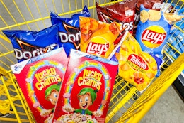 2 boxes of lucky charms, 6 bags of chips and a bag of pizza rolls in a cart
