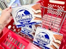 hand holding box of Klondike ice cream in front of shopping cart