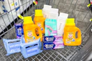 neutrogena makeup wipes, crest toothpaste, skintimate razors, native body wash, and arm & hammer detergent in a cart