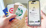 A woman fans out a stack of Starbucks gift cards