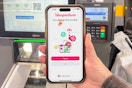 someone opening up the Shopmium app in Walmart