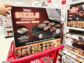 ninja sizzle indoor grill sitting on a target cart