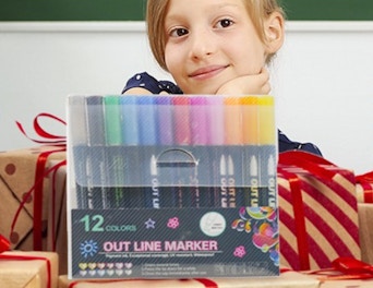 a pack of markers on top of presents in front of a little gril