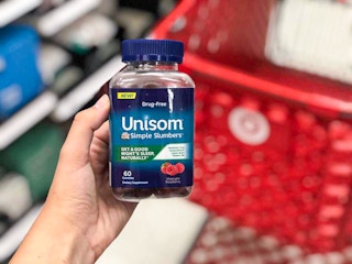 hand holding a bottle of unisom simple slumbers at target