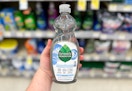 hand holding a bottle of seventh generation dish soap