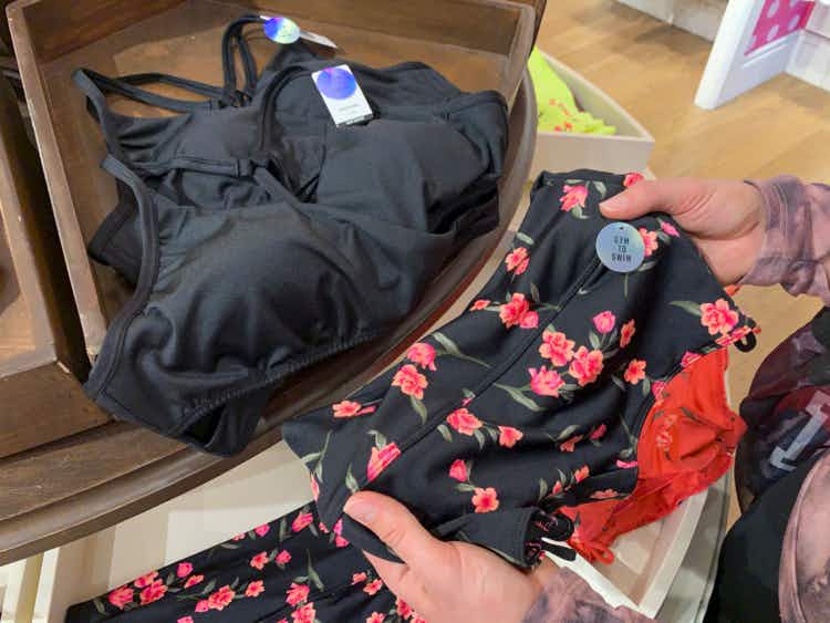 Person looking at two-piece swimsuits.