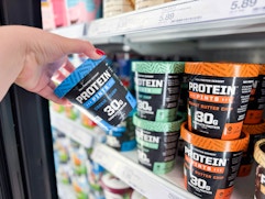hand grabbing a protein pints ice cream off a target shelf