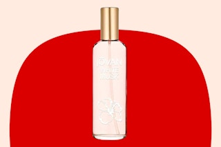 Stock image of Jovan White Musk Perfume Spray over red/cream max shape background