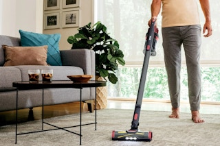 man using shark vacuum