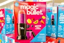 pink and blue Magic Bullet personal blender box on other Magic Bullet blenders