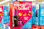 pink and blue Magic Bullet personal blender box on other Magic Bullet blenders