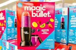 pink and blue Magic Bullet personal blender box on other Magic Bullet blenders