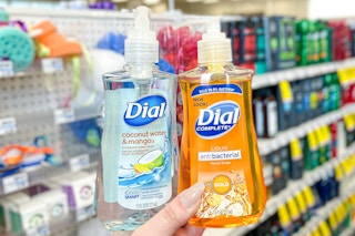 hand holding two Dial hand soaps