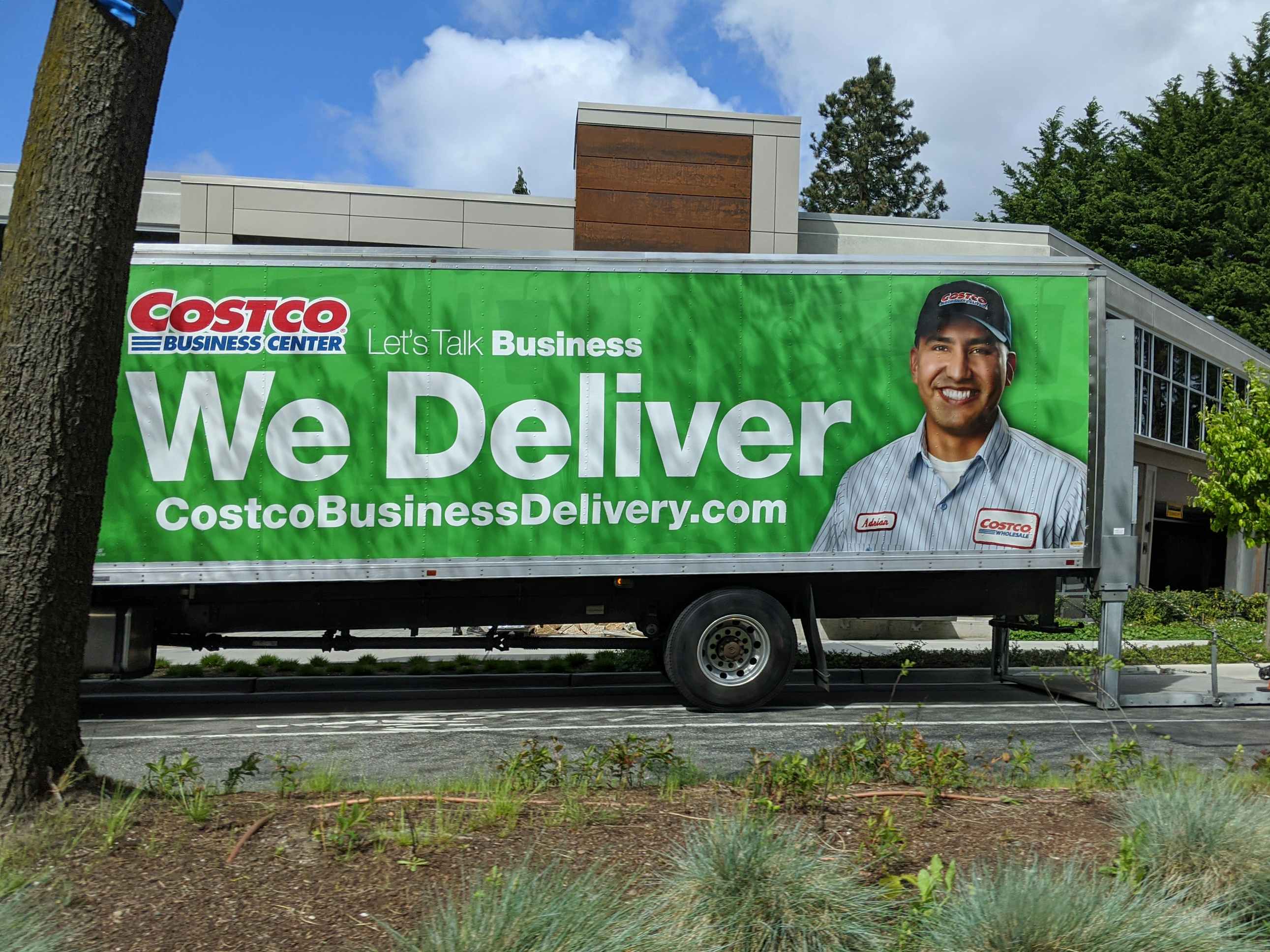 A Costco Business Center delivery truck parked outside its destination