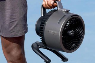 a shark rechargeable hydrogo fan being carried