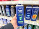hand holding nivea men body wash in walgreens