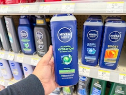 hand holding nivea men body wash in walgreens