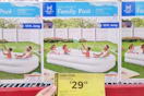 hand holding clearance tag for members mark family pool
