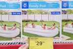 hand holding clearance tag for members mark family pool