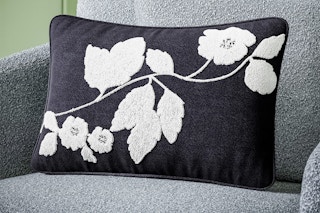Lifestyle image of the Beautiful Boucle Embroidered Chenille Floral Decorative Pillow by Drew Barrymore (from Walmart)