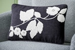 Lifestyle image of the Beautiful Boucle Embroidered Chenille Floral Decorative Pillow by Drew Barrymore (from Walmart)