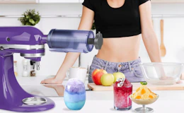 a shaved ice attachment on a purple stand mixer next to shaved ice