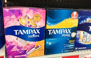 Boxes of Tampax tampons on a store shelf